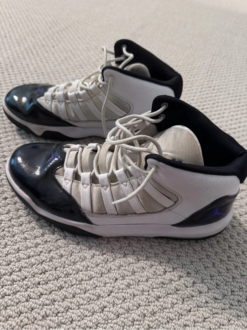 Jordan White and Black High-Top Sneakers with Purple Accent